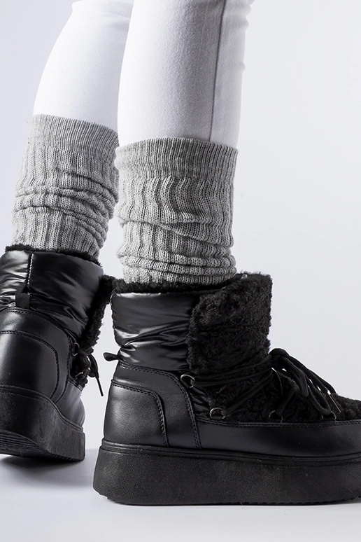 Mustad lumesaapad massiivsel Elvio...