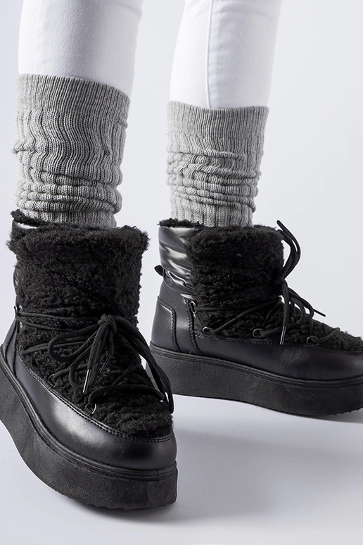 Mustad lumesaapad massiivsel Elvio...