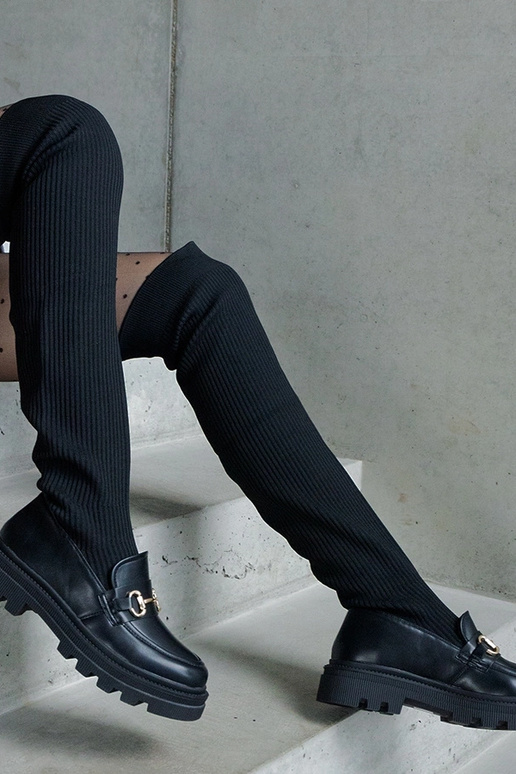 Mustad saapad elastse varruga lamedal...