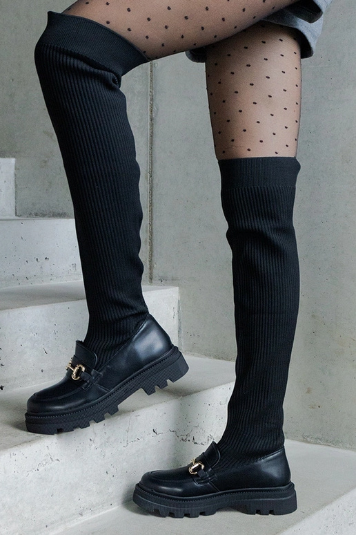 Mustad saapad elastse varruga lamedal...