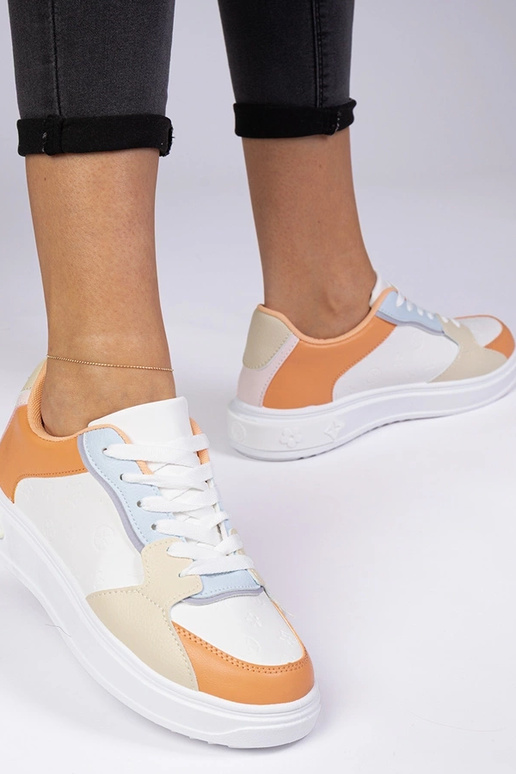 Valged-oranžid spordijalatsid...