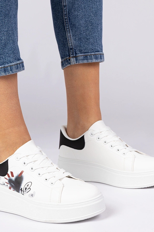 Valge-mustad naiste spordijalatsid...