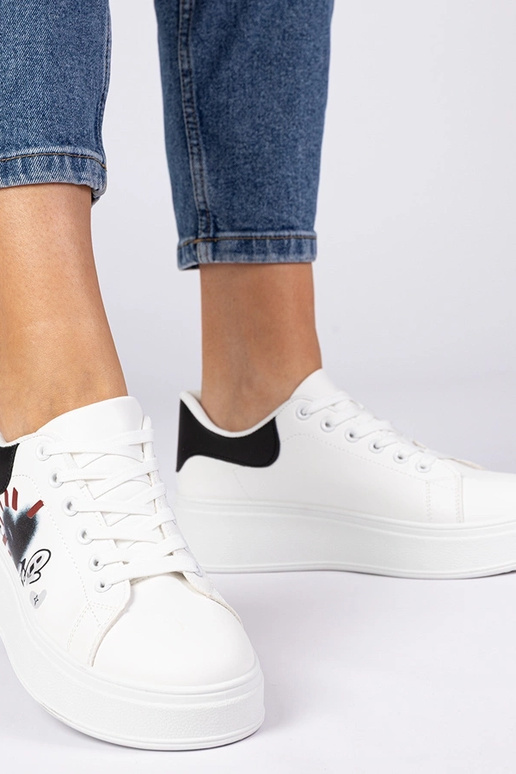 Valge-mustad naiste spordijalatsid...