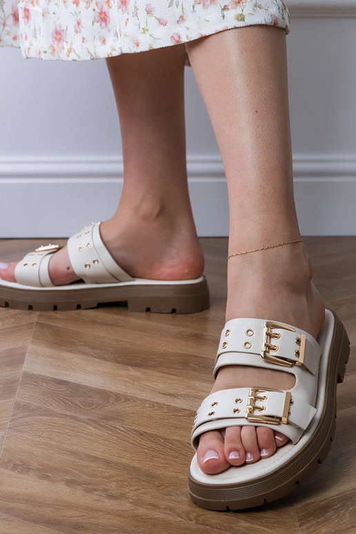 Kreemikad lamedad sussid rihmade...