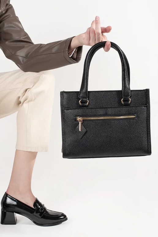 Must käekott lukuga