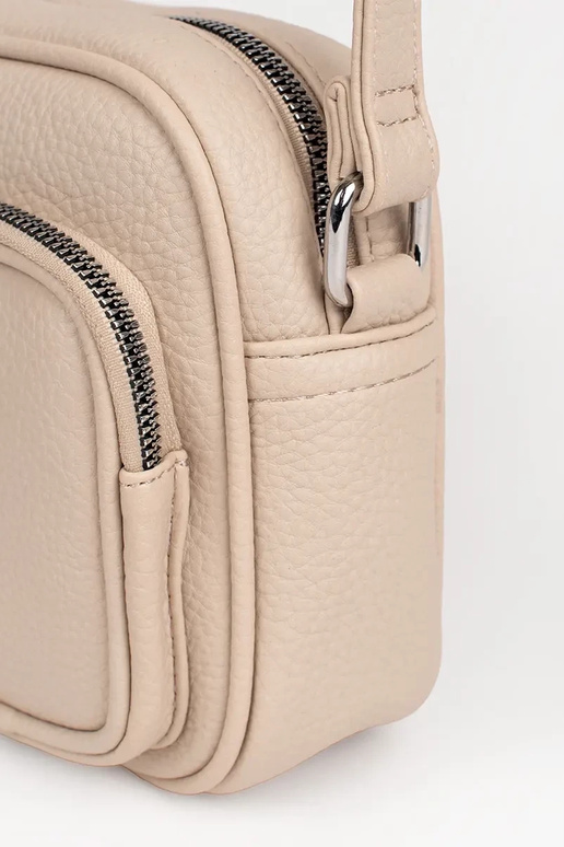 Elevandiluust värvi väike käekott...