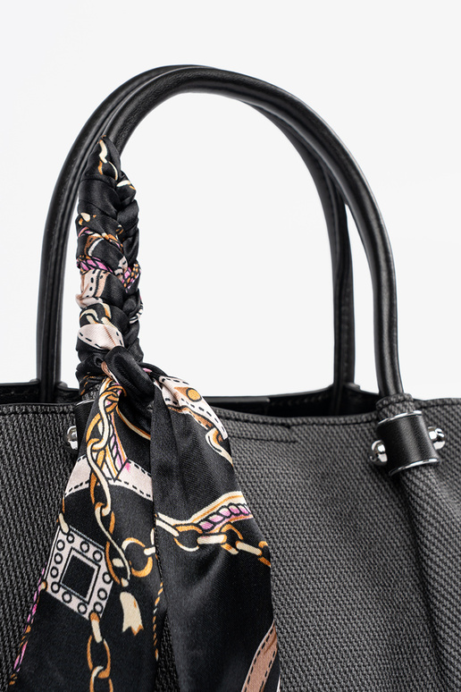 Must keskmise suurusega käekott...