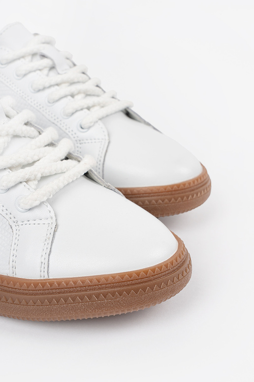 Valged nahksed naiste spordijalatsid...