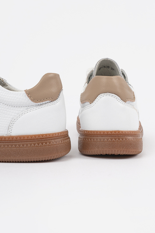 Valged nahksed naiste spordijalatsid...