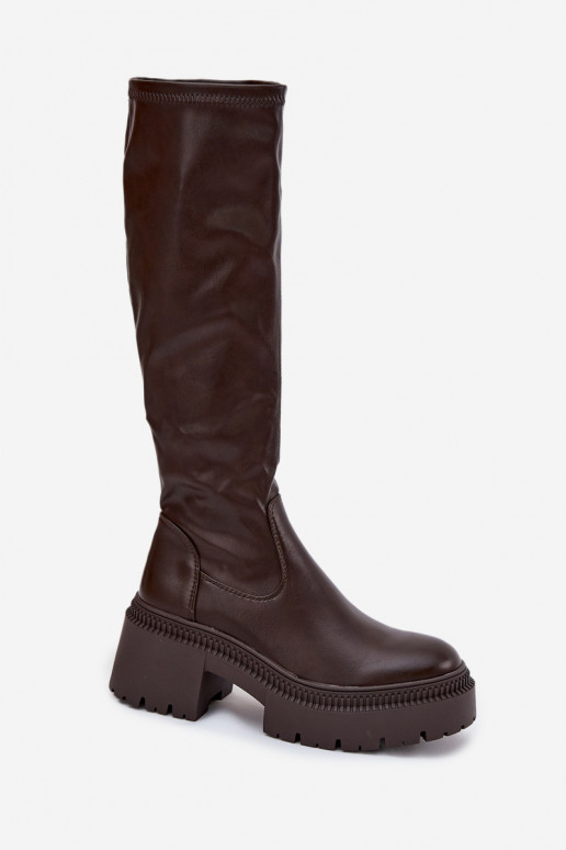 Naiste pikad saapad massiivsete kontsade ja platvormiga slip-on mudel pruuni värvi Florinne Naiste pikad saapad massiivsete kontsade ja platvormiga slip-on mudel pruuni värvi Florinne