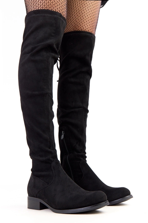 Mustad pikad saapad lamedal tallal...