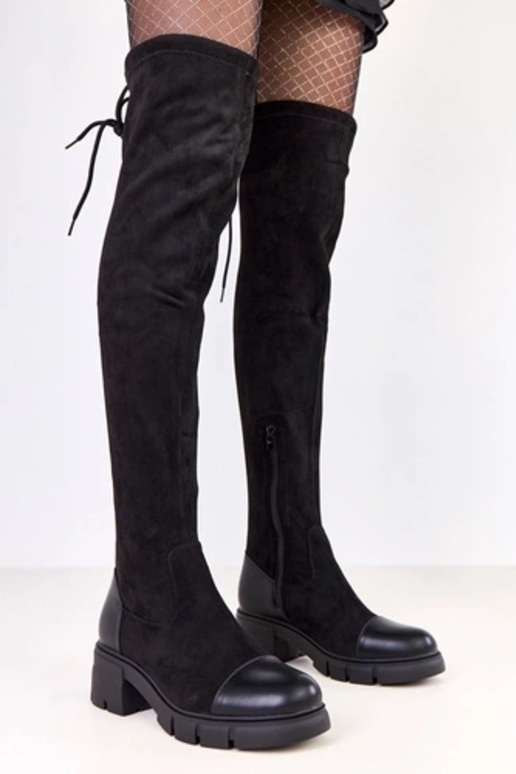 Mustad kunstsuede saapad üle põlve...