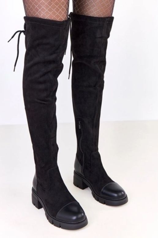 Mustad kunstsuede saapad üle põlve...