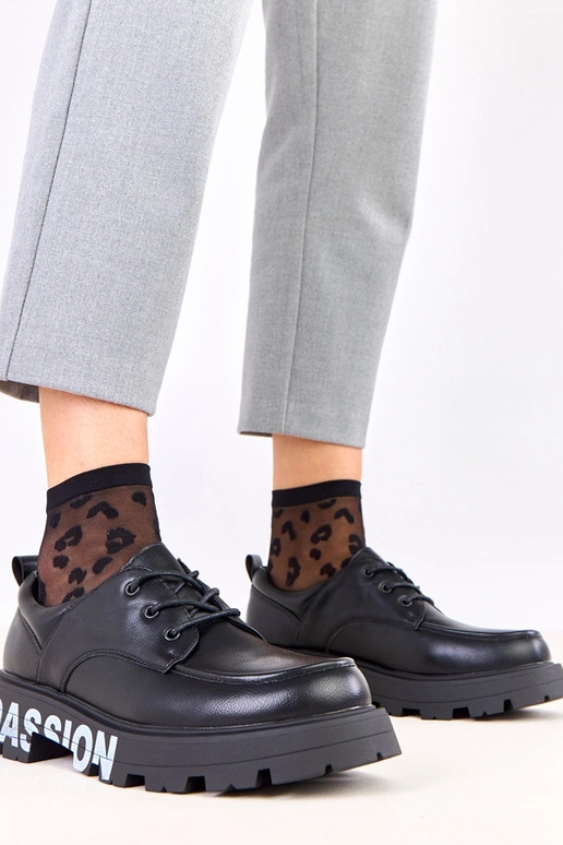 Mustad naiste poolsaapad mustriga Klowis