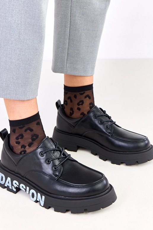 Mustad naiste poolsaapad mustriga Klowis