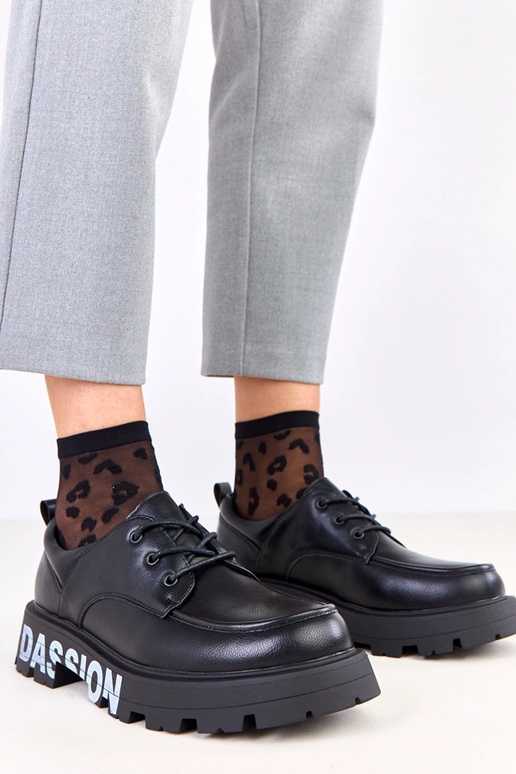 Mustad naiste poolsaapad mustriga Klowis