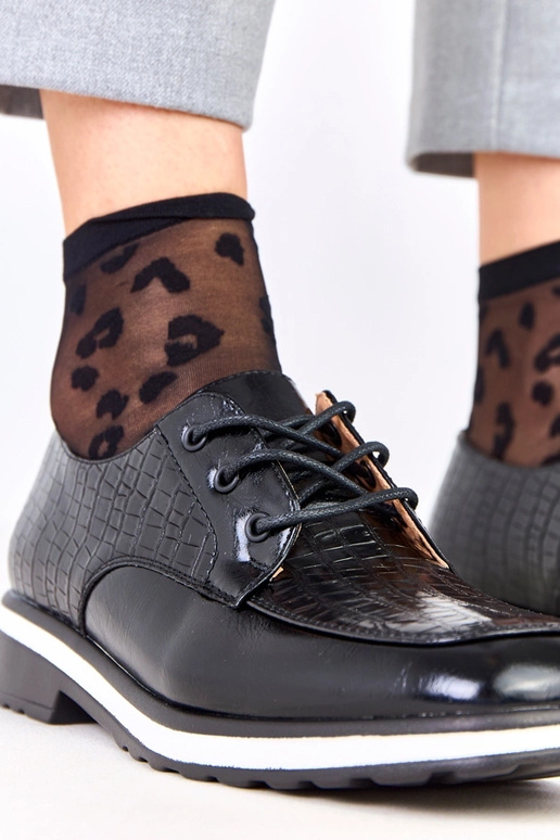 Mustad poolsaapad reljeefiga ja...