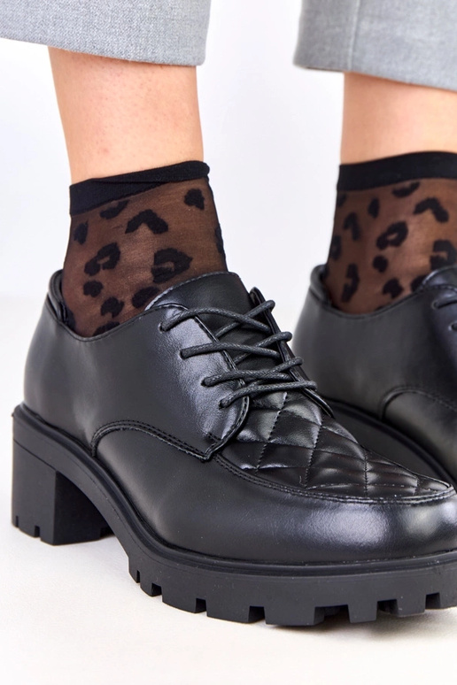 Mustad poolsaapad tikitud sisetükiga...