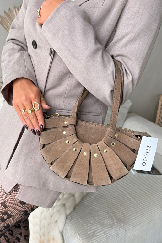 KäekottPealturalnego seemisnakhsedu elevandiluu värvi Sellel onrivane KäekottPealturalnego seemisnakhsedu elevandiluu värvi Sellel onrivane