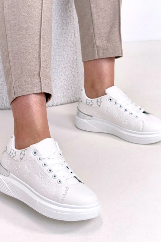 Valged spordijalatsid tihedusega Peyton