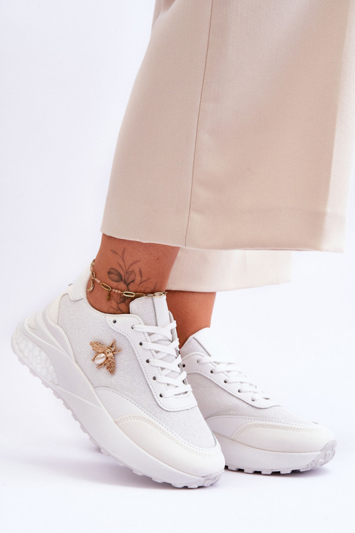 Läikivad jalatsid sportlikud jalatsid kaunistustega valget värvi Seneca