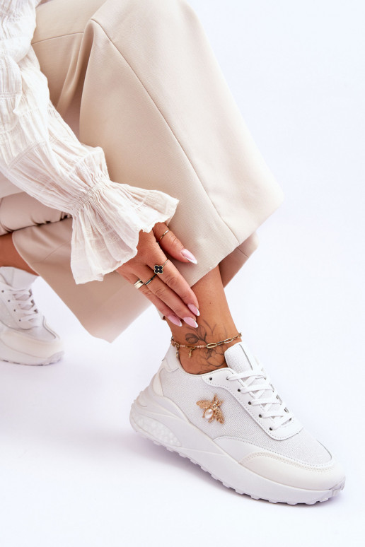 Läikivad jalatsid sportlikud jalatsid kaunistustega valget värvi Seneca