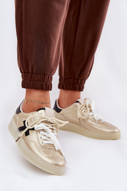 Sellel ondal spordijalatsid Pealiste omad Kuldset värvi Zelevelis Sellel ondal spordijalatsid Pealiste omad Kuldset värvi Zelevelis