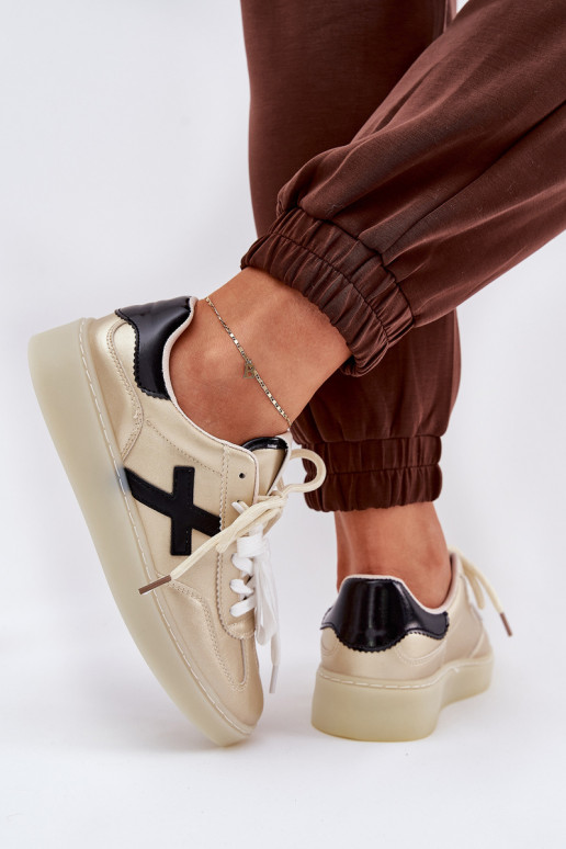 Sellel ondal spordijalatsid Pealiste omad Kuldset värvi Zelevelis Sellel ondal spordijalatsid Pealiste omad Kuldset värvi Zelevelis