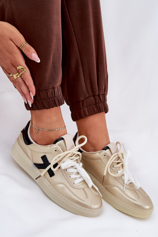 Sellel ondal spordijalatsid Pealiste omad Kuldset värvi Zelevelis Sellel ondal spordijalatsid Pealiste omad Kuldset värvi Zelevelis